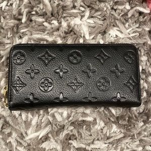 Black zippy wallet.